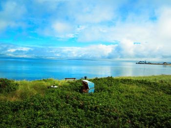 Scenic view of sea against cloudy sky