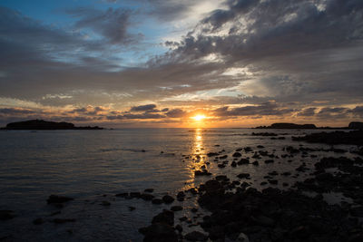 Scenic view of sea against sky during sunset