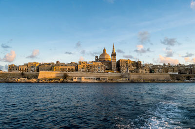 View of buildings in city at waterfront