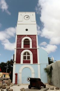 Low angle view of clock tower against sky