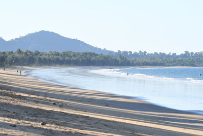 Scenic view of beach against clear sky