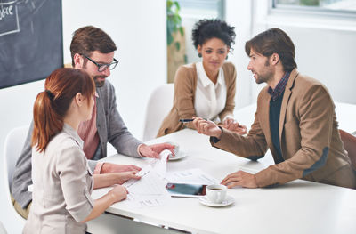 Business colleagues working at office