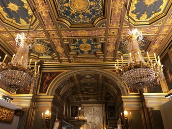 Low angle view of illuminated ceiling of building