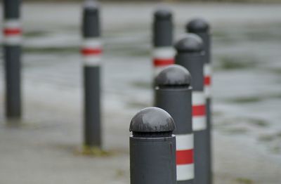 Close-up of posts on street