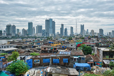 High angle view of buildings in city against sky