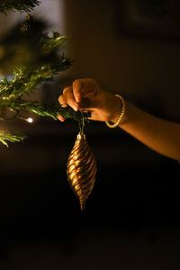 Close-up of woman hand holding illuminated lighting equipment