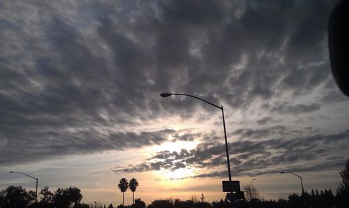 Low angle view of cloudy sky at sunset