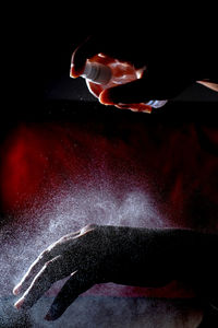 Close-up of hand on illuminated light painting