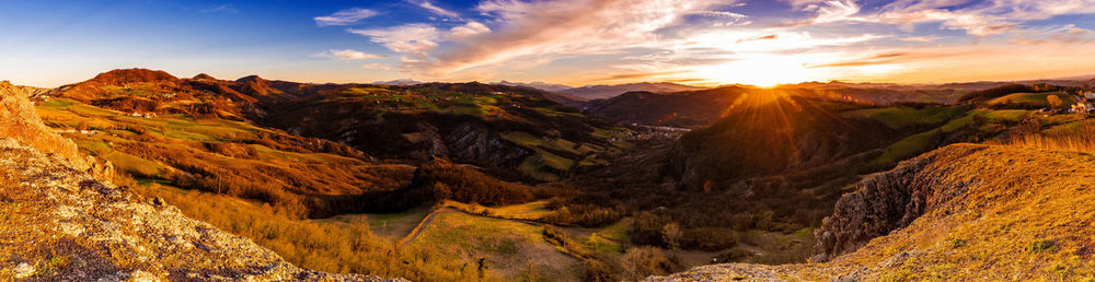 Scenic view of mountains against sky during sunset