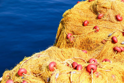 Close-up of fishing net against blue sea