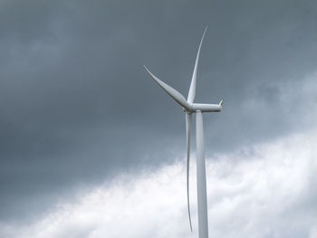 Low angle view of wind turbine against sky