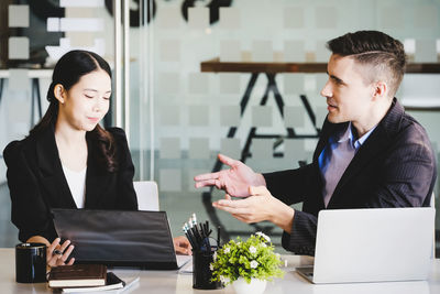 Portrait of young businesswoman working at office