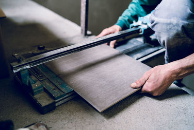 Midsection of man working at construction site