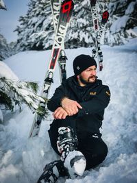 Full length of man on snowcapped mountains during winter