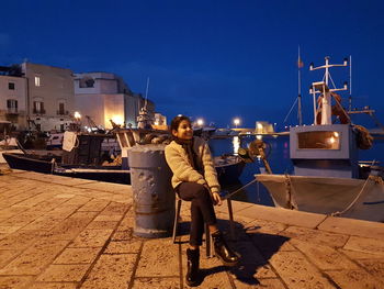 Full length of young couple against clear sky at night