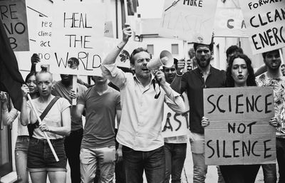 People protesting while standing on land