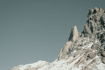 Scenic view of snowcapped mountains against clear sky