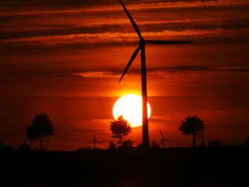 Silhouette of trees against sky at sunset