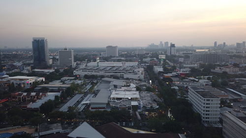 High angle view of buildings in city against sky