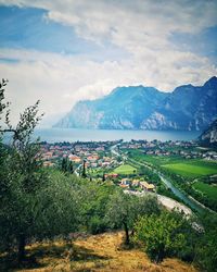 Scenic view of field and mountains against sky