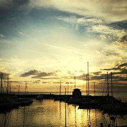 Sailboat in sea at sunset