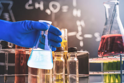 Cropped hand of scientist experimenting in laboratory