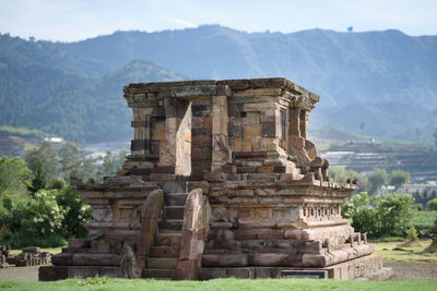 Ruins of temple against mountain