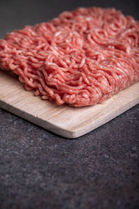 Close-up of meat on cutting board