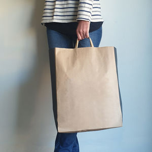 Low section of woman standing against wall