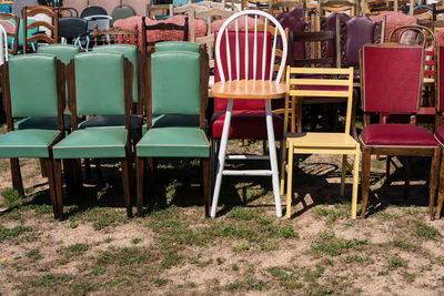 Empty chairs on field