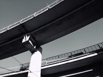 Low angle view of urban highway against sky