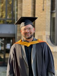 Portrait of woman wearing graduation gown