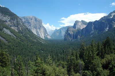 Scenic view of mountains against blue sky