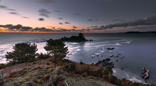 Scenic view of sea against sky during sunset