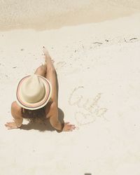 Young woman lying on beach