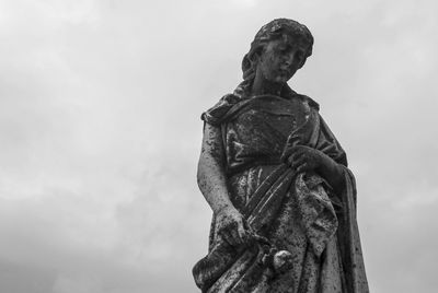 Low angle view of statue against sky