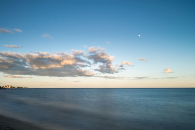 Scenic view of sea against sky at sunset