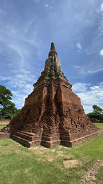 Temple against cloudy sky