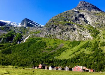 Panoramic view of houses and trees against sky