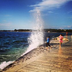 Woman jumping in water