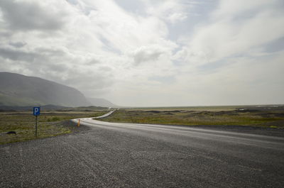 Empty road along landscape