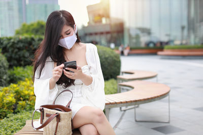 Young woman using mobile phone