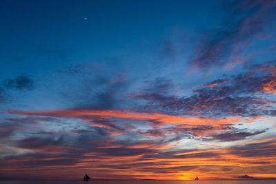 Low angle view of dramatic sky during sunset