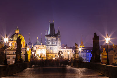 Illuminated city lit up at night