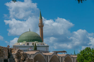 Low angle view of mosque against sky