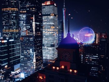 Illuminated buildings in city at night