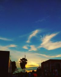 Low angle view of silhouette buildings against sky during sunset