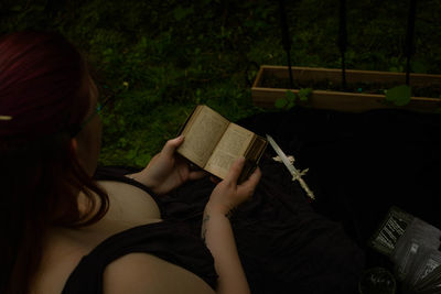 Young woman reading book