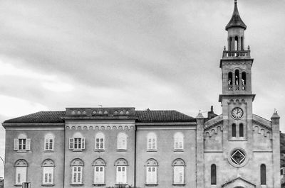 Low angle view of clock tower against sky