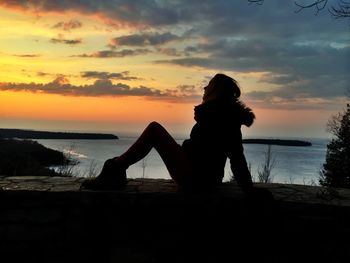 Silhouette of people at sunset